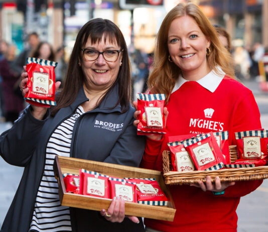 McGhee’s teams up with Brodies to save the tea break Mina MacKenzie, retail partner manager at Brodies, and Aisling McGhee, commercial director at McGhee's, stand outside Glasgow Central Station holding packs of McGhee's individual biscuits with Brodies tea bag attached to it. Each also hold a wicker basket with more biscuit and tea combos.