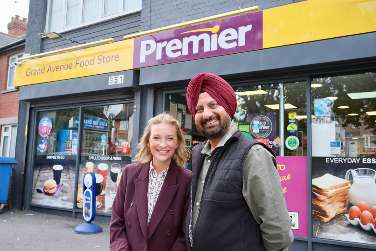 Kulijt Athwal, owner of Premier Grand Avenue Stories in Cardiff, and actress Joanna Page stand outside the Premier store.