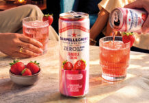 Sanpellegrino adds new Strawberry Crema to Zero range A can of Sanpellegrino Zero Strawberry Crema stands on a table with glasses with the drink inside them behind it and a bowl of strawberries next to it.
