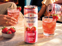 Sanpellegrino adds new Strawberry Crema to Zero range A can of Sanpellegrino Zero Strawberry Crema stands on a table with glasses with the drink inside them behind it and a bowl of strawberries next to it.